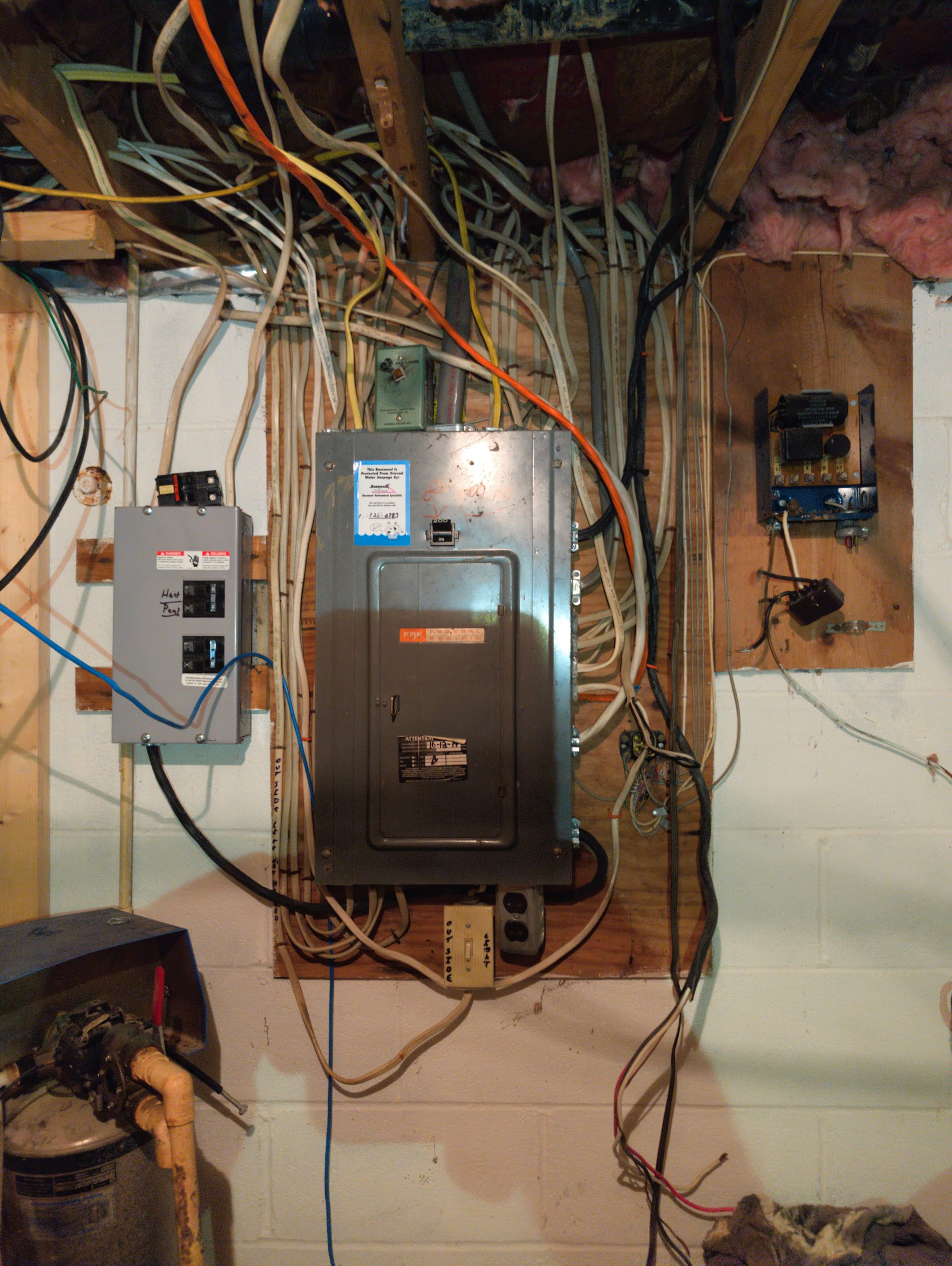 Outdated, overloaded electrical panel before replacement
