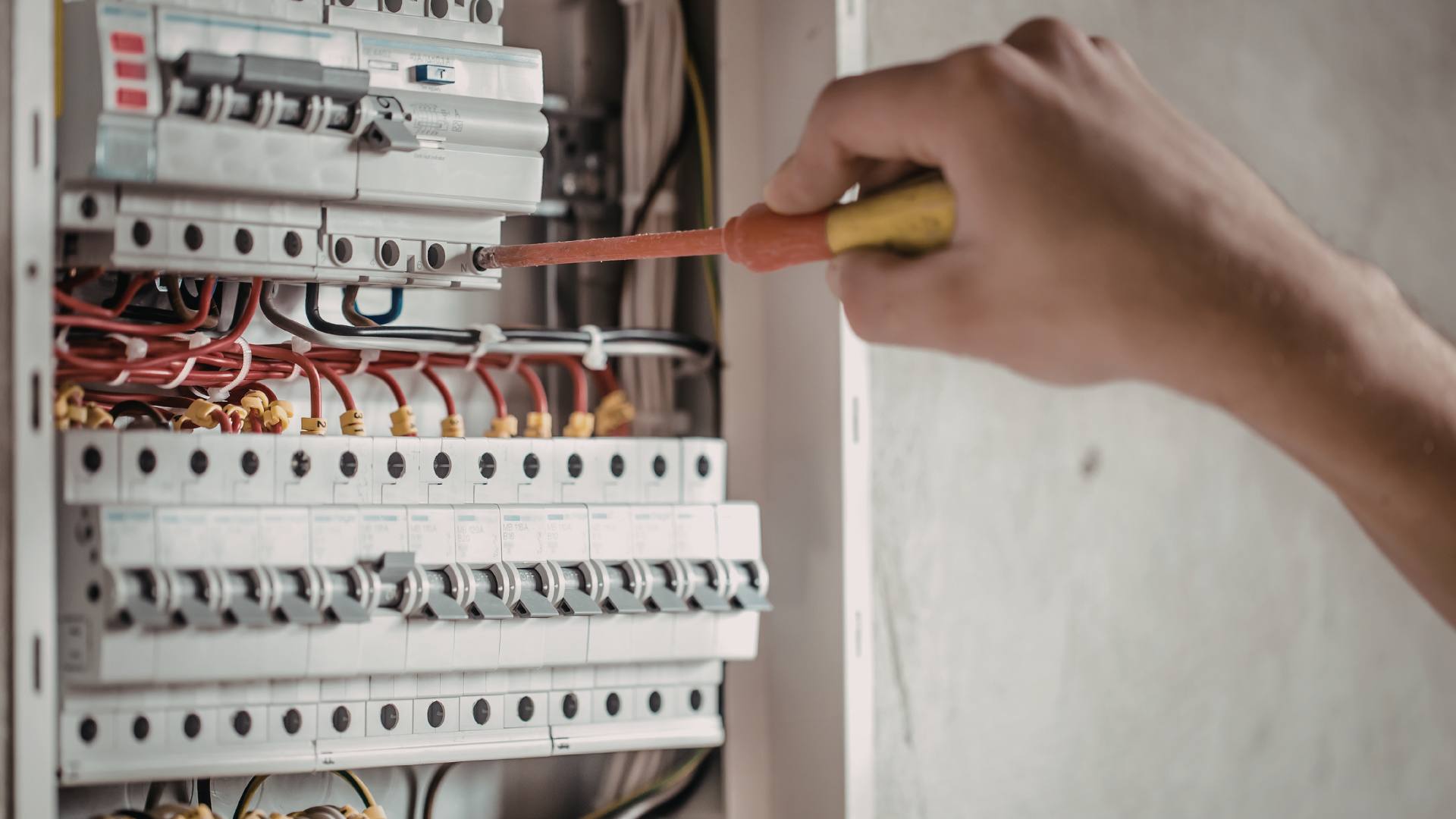 Electrician restoring power during an outage